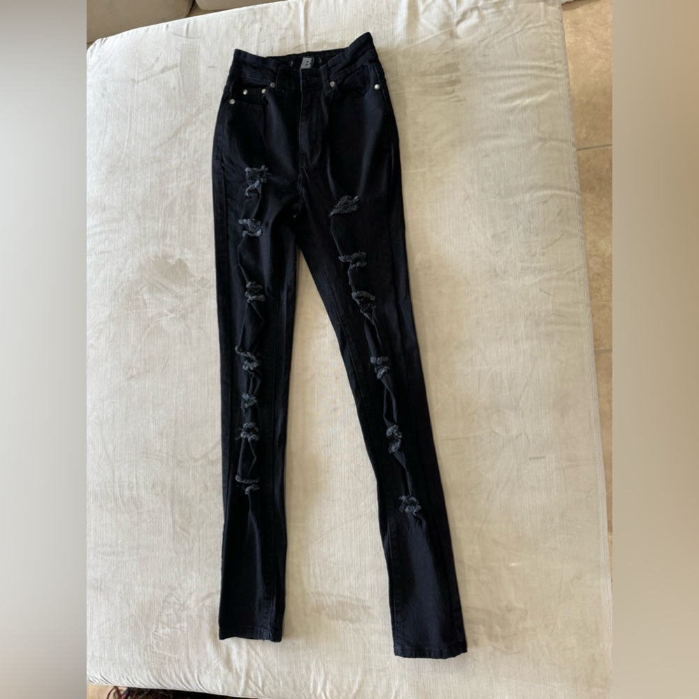 Vibrant black ripped jeans